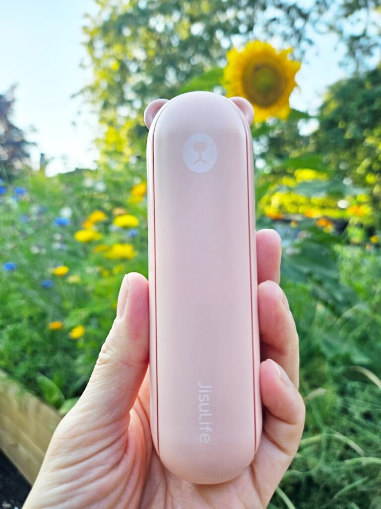 JISULIFE 3-in-1 handheld fan folded for easy carrying