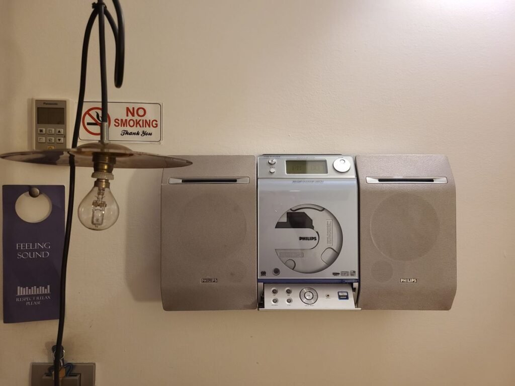 Music-themed device on the wall in the guest room
