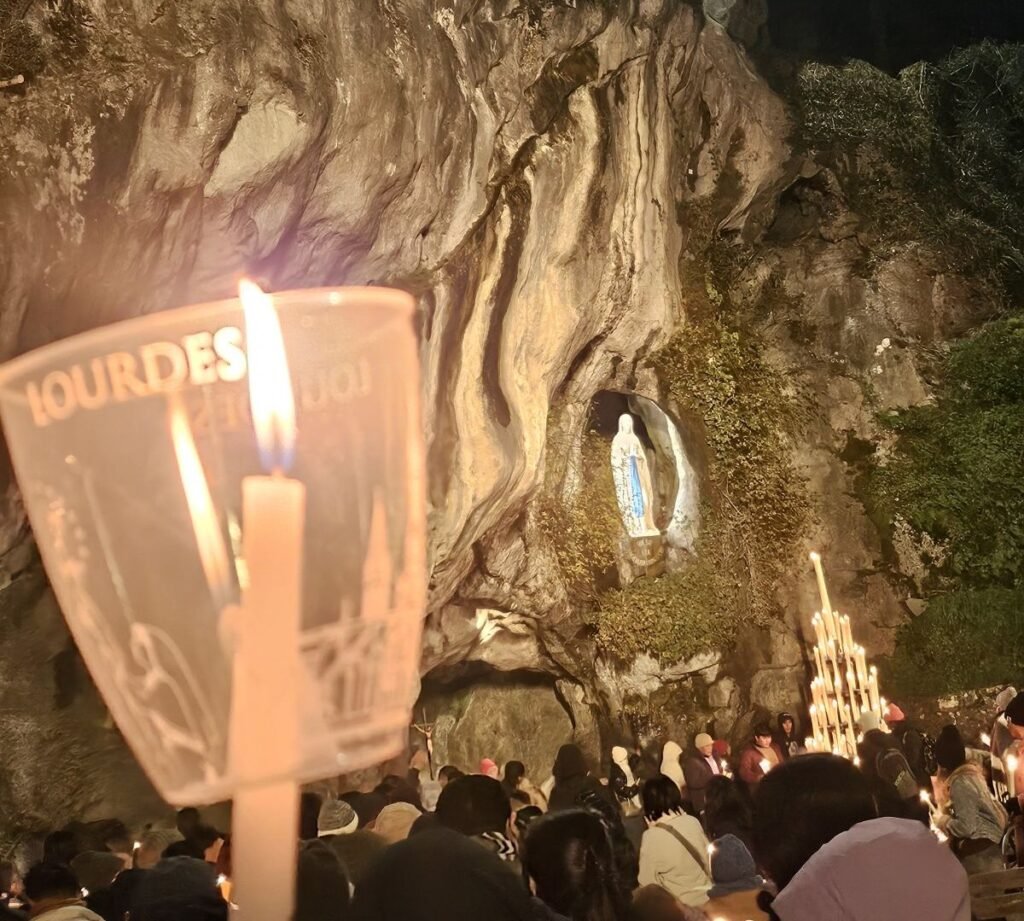 Candle held during the evening Rosary in Lourdes