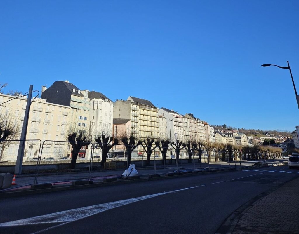 Riverside street in Lourdes, France