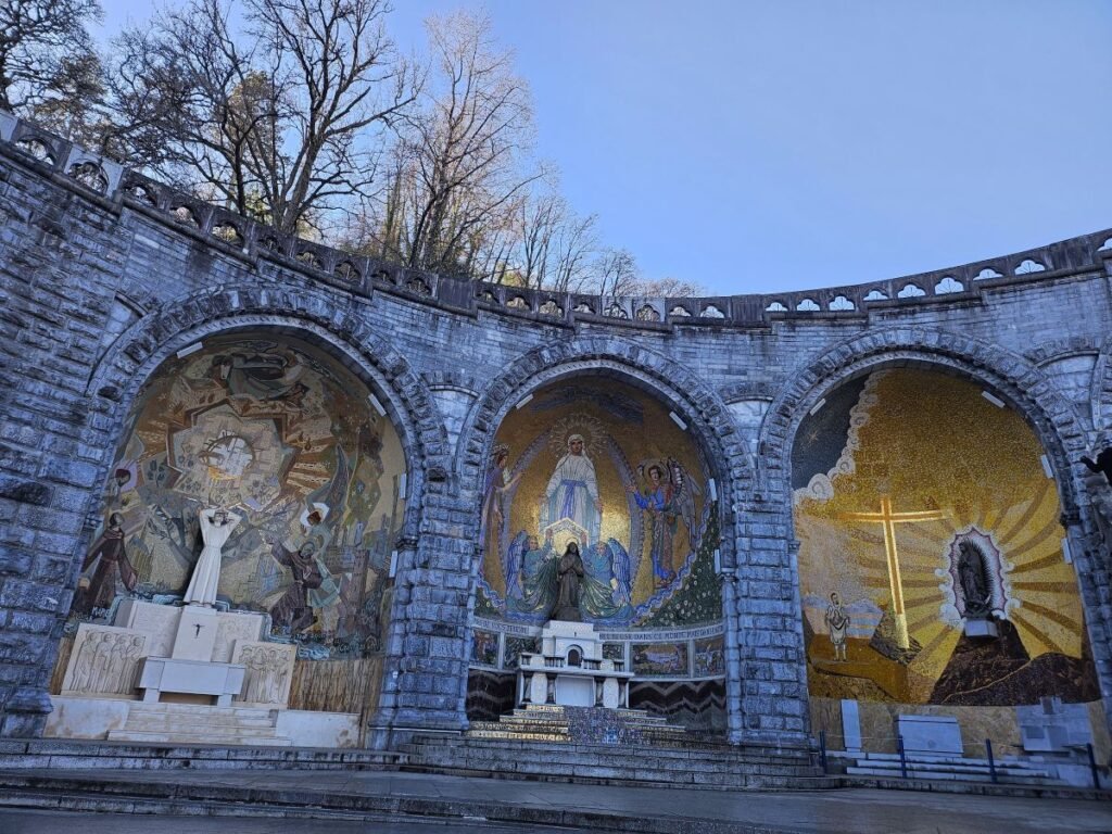 Religious mosaics beside the Rosary Basilica in Lourdes