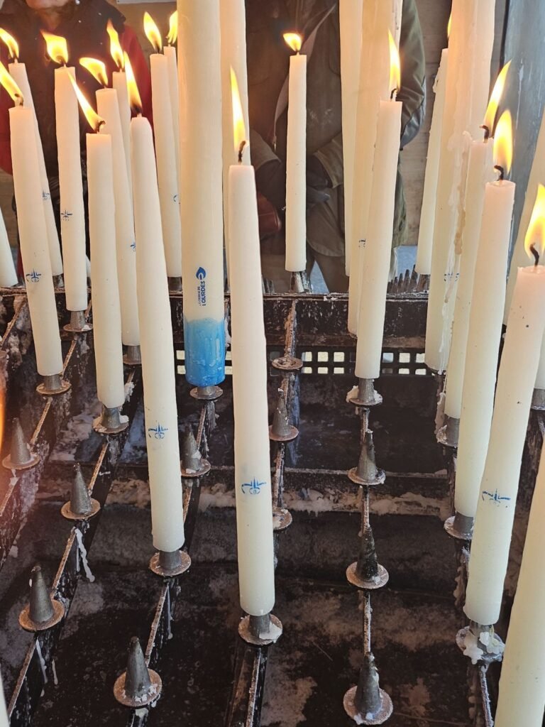 Votive candles burning at Lourdes Sanctuary