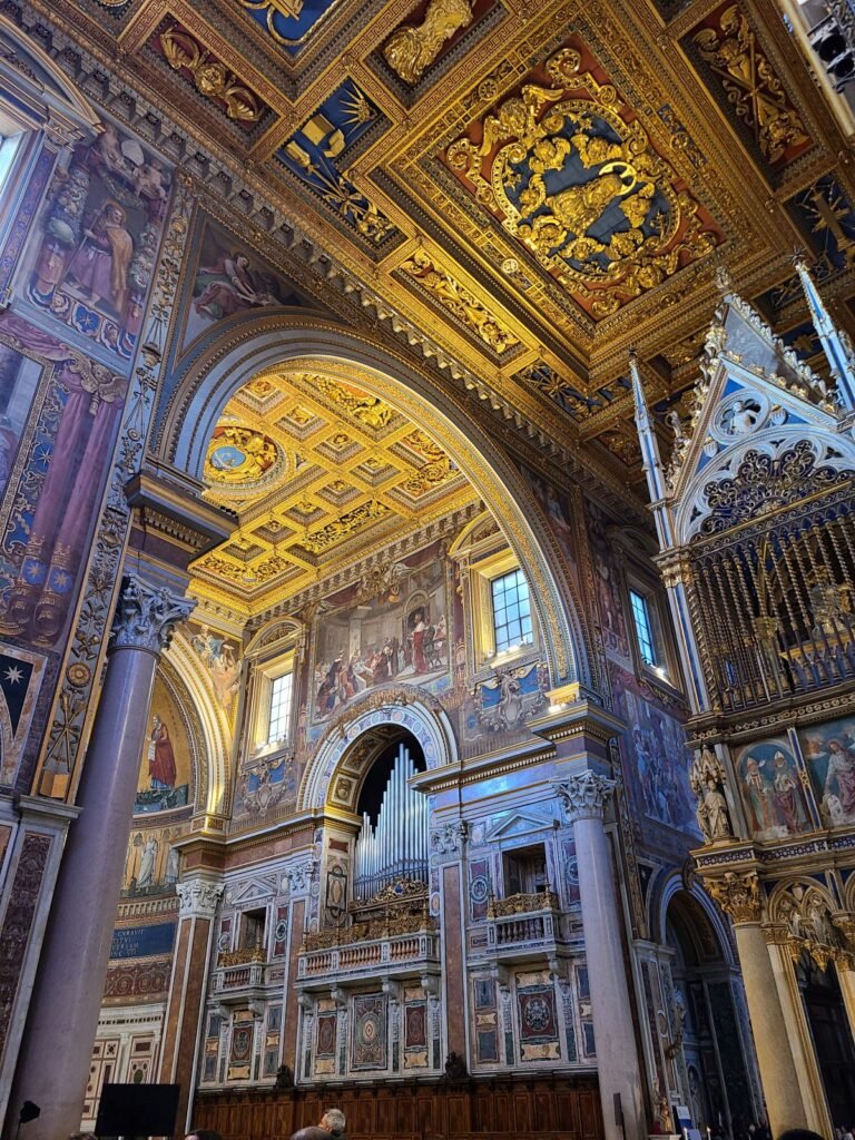 ALT: Interior of St. John Lateran Basilica with its golden ceiling